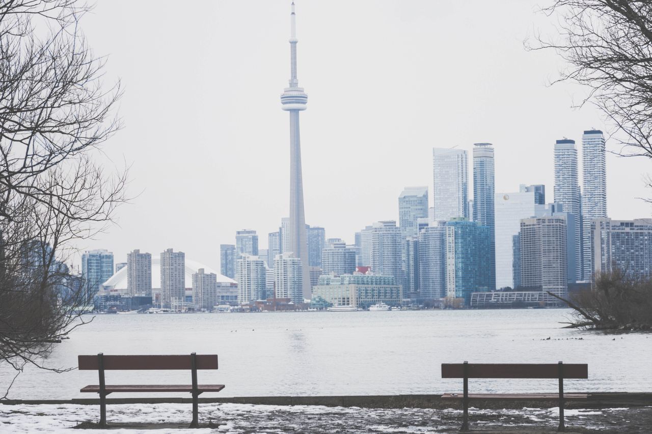 Scenic winter view of Toronto skyline, featuring the iconic CN Tower and waterfront.
